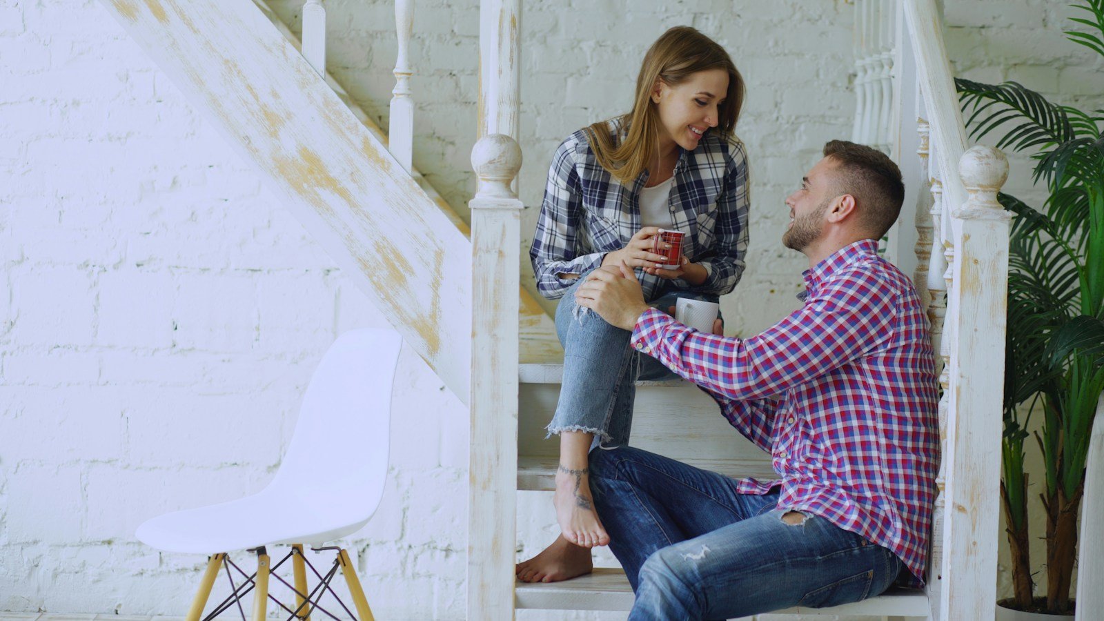 A couple talking at home while reflecting on the relationship they have and the one they hope for